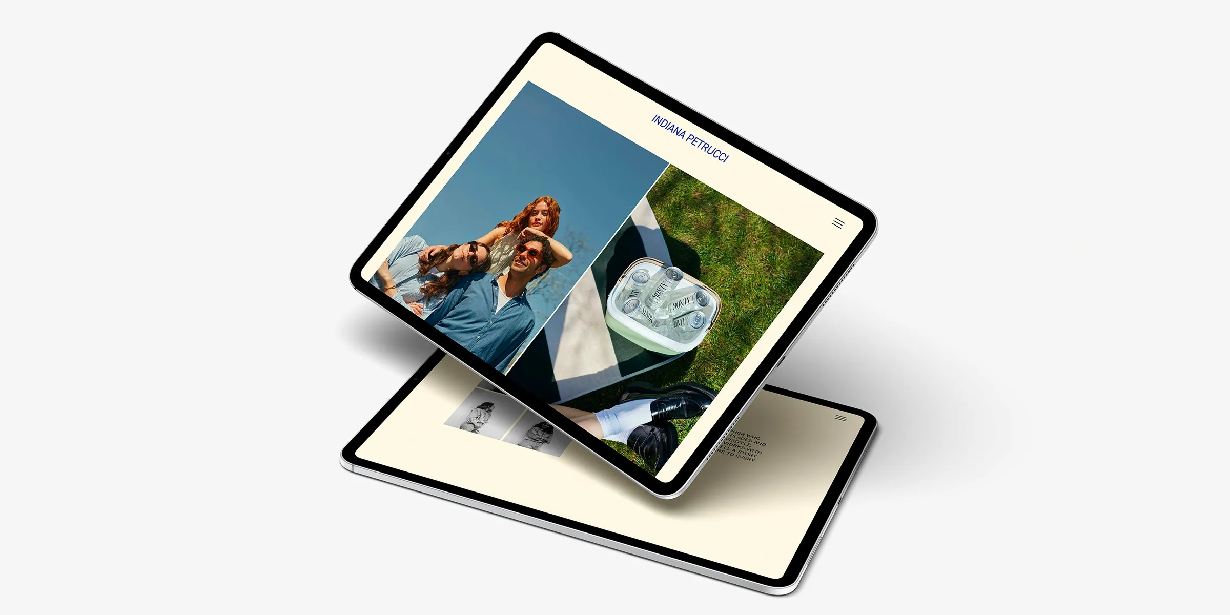 A digital presentation showcasing a sleek portfolio layout on two tablets, featuring a smiling couple outdoors and a close-up of a portable fridge with beverages, highlights the creativity and style available on a photographer’s website.